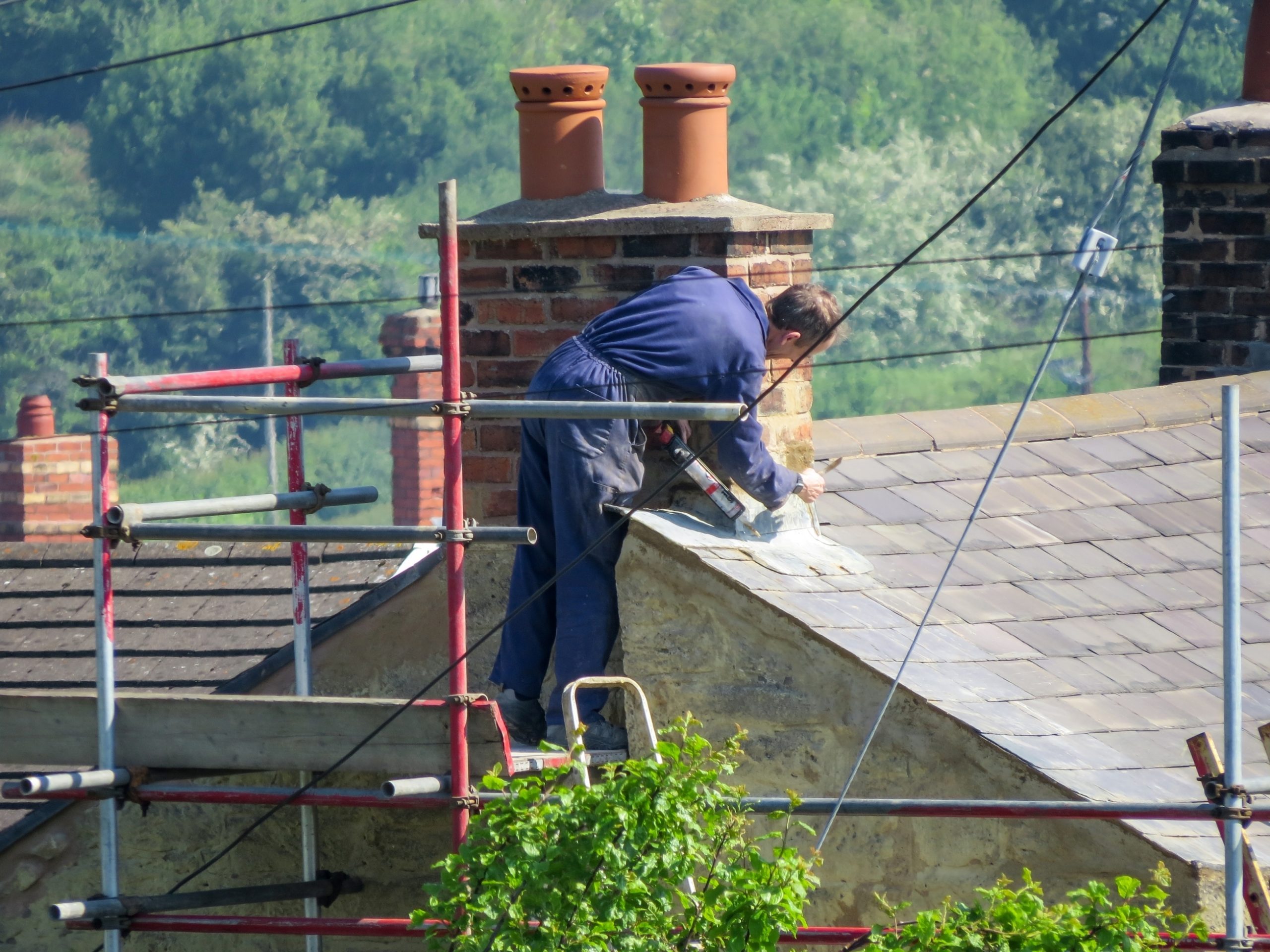 Wrexham,,Uk,-,May,25,,2017:,Roofer,Repairing,Flashing,On